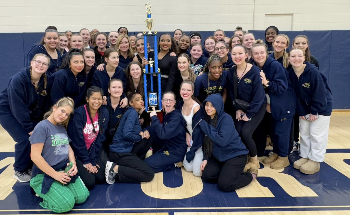 Cathedral High School Show Choir team holds the Grand Champion trophy on February 1, 2025. The photo of Cathedral’s Show Choir team show the reward that was earned after a long and tiring 12 hours of performing shows at Decatur Central High School. Sophomore Jennifer Velazquez exclaimed, “I was so surprised when we had won, but we carried the trophy with pride!”